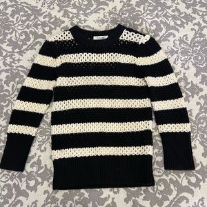 Frame open knit sweater. 100% wool. Black and white stripe. Size small.